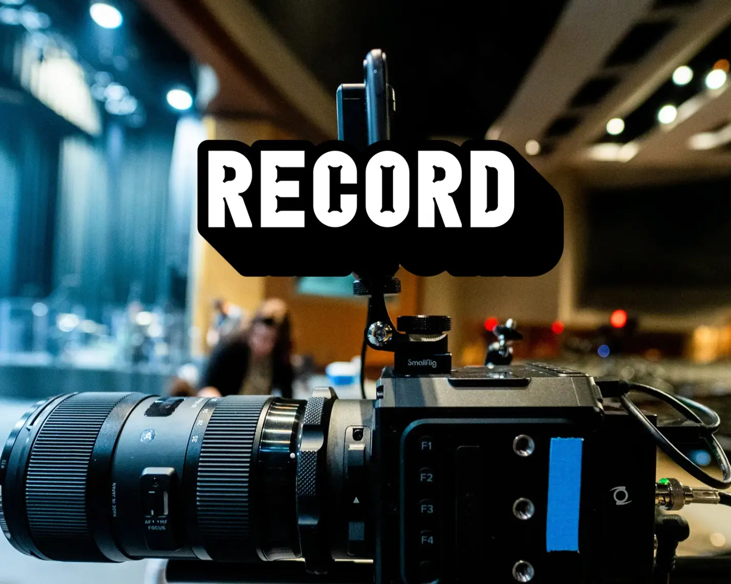 Phone mounted on a cinema camera recording branded creator content